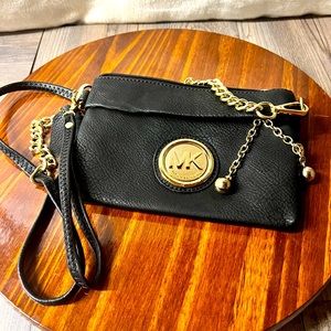 Michael Kors Wristlet In Black Leather Inner Pockets with chain decorations